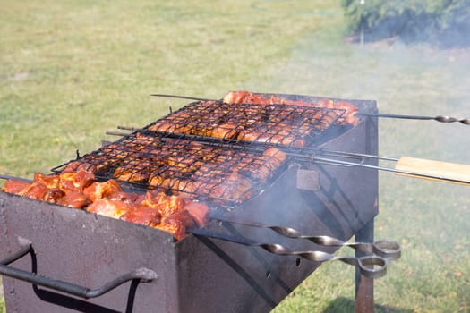 Custom made rusty metal barbeque with meat on it