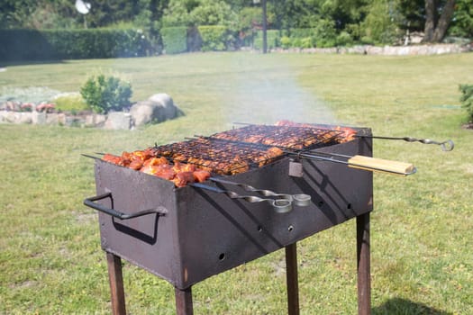 Custom made rusty metal barbeque with meat on it