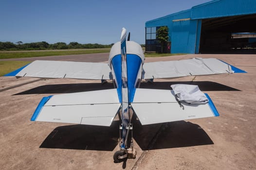 Small two seater prop plane aircraft covered .