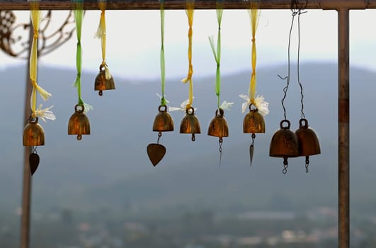 Golden bells hanging mountains in the background