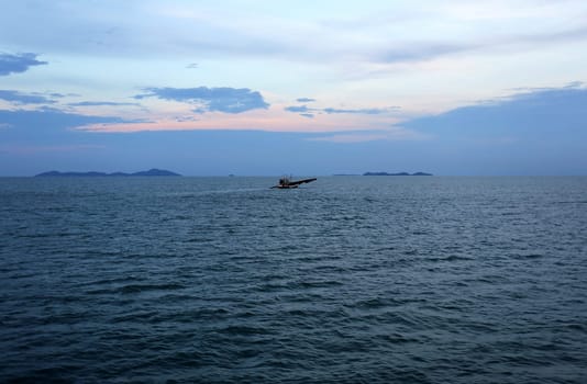 beautiful seascape with the island on the background of blue sky with