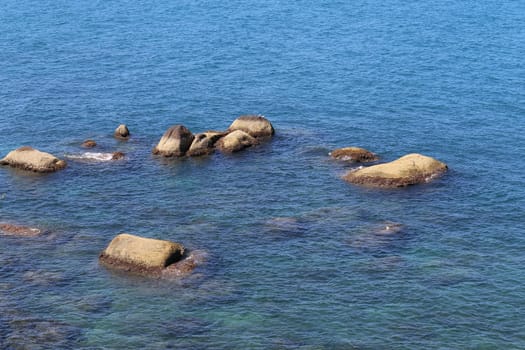 beautiful seascape with the island on the background of blue sky with