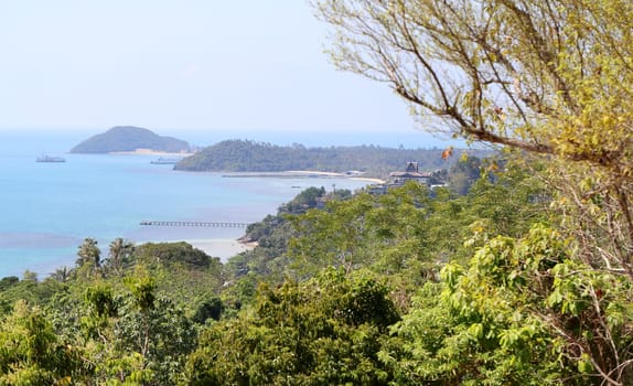 beautiful seascape with the island on the background of blue sky with