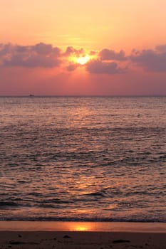 Sunset in the sea among the clouds