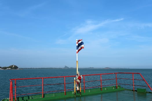 Thai flag on the ferry in the sea photographed closeup
