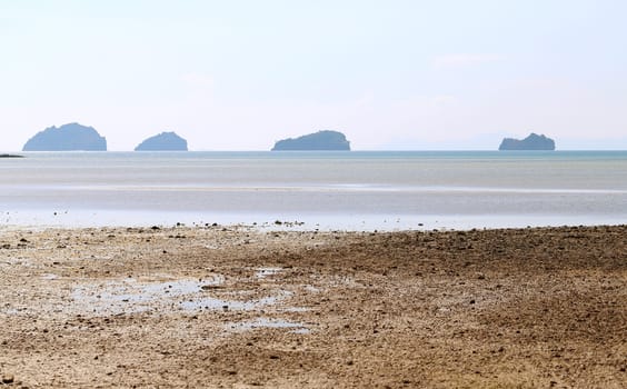 beautiful seascape with the island on the background of blue sky with