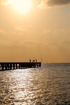 Sunset in the sea among the clouds