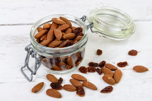 almonds with raisins dry in a glass jar