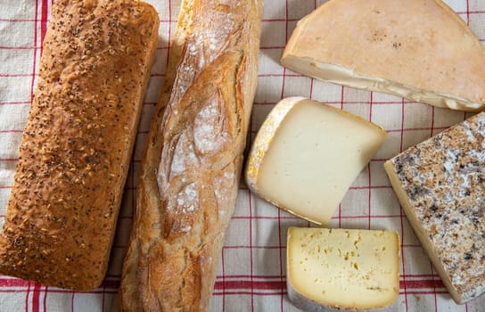 cheeses and Tomme de Savoie, bread, French cheese Savoy, french Alps France.