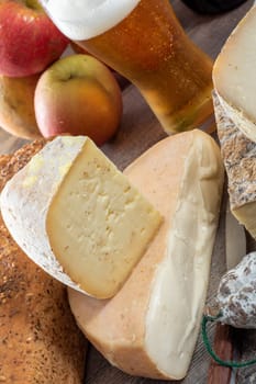 cheeses and Tomme de Savoie with beer, French cheese Savoy, the french Alps France.