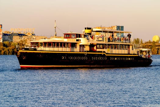 A boat sailing on Dnipro river in Dnipro city, Ukraine. The photo taken on 13.10.19