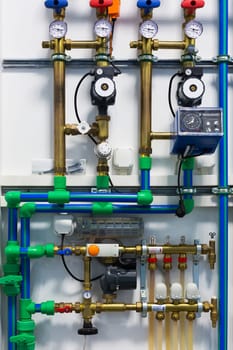 Pipes, pumps, valves and thermostats of heating system