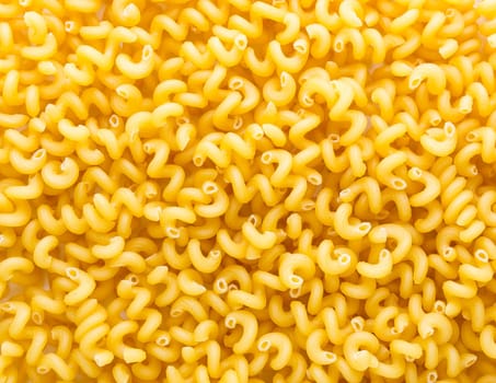 Heap of yellow macaroni. Background