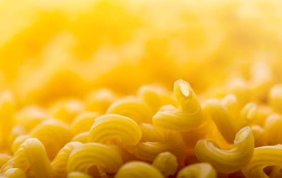 Heap of yellow macaroni closeup