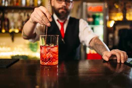 Attractive alcoholic drink preparation show. Professional bartending