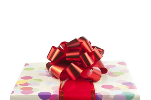 Gift with big red bow and ribbon isolated on white