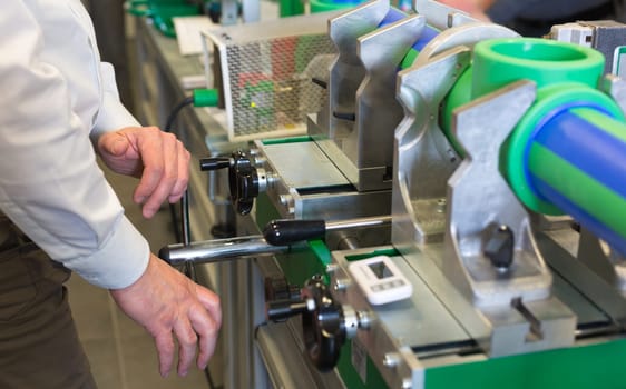 Mechanic working on a machine at workroom
