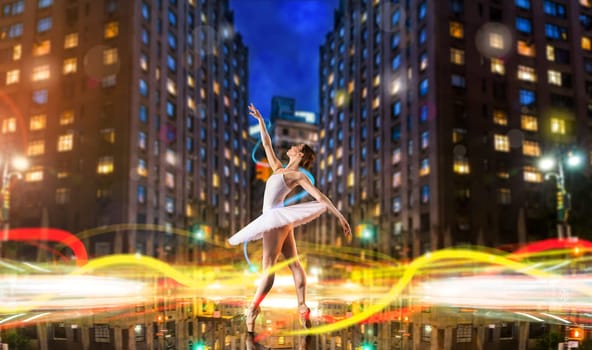 Classical ballet dancer in white dress dancing on city road, cityscape with long exposure light effect. Graceful ballerina poses in studio