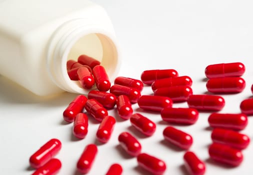Pills spilling from an open bottle