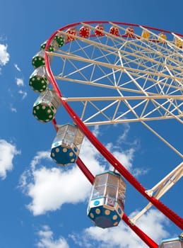 Ferris wheel against blue sky