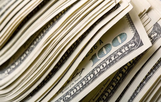 Heap of $100 dollar bills