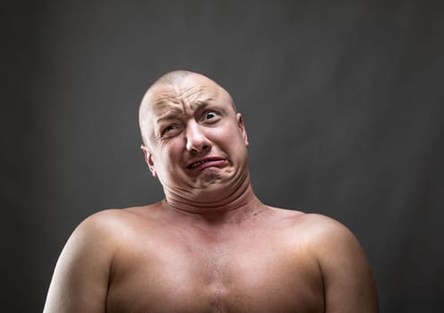 Stressed man making a face