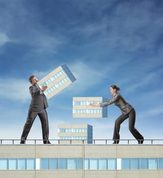 Business people are constructing a skyscraper as a symbol