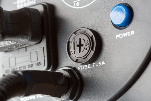 Closeup of electrical fuse on system unit with cables
