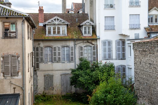 a facade of old building, french town