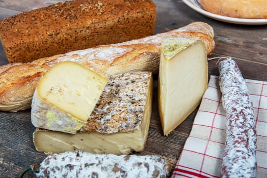 cheeses, sausage and Tomme de Savoie, Savoy, the french Alps France.