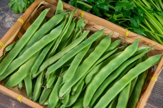 organic flat beans on the wooden background