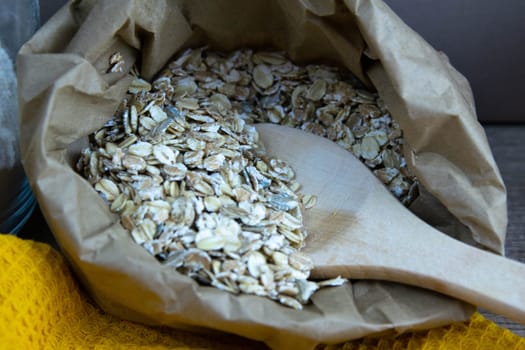 Women's hands mix the dough on a wooden table. Preparing bread for baking. Front views