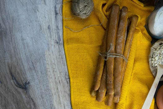 Women's hands mix the dough on a wooden table. Preparing bread for baking. Front views