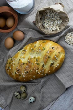 Women's hands mix the dough on a wooden table. Preparing bread for baking. Front views