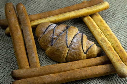 Women's hands mix the dough on a wooden table. Preparing bread for baking. Front views