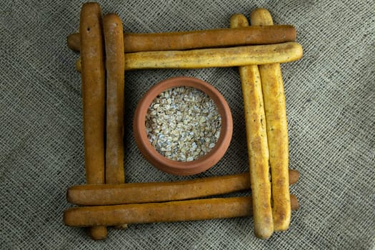 Women's hands mix the dough on a wooden table. Preparing bread for baking. Front views