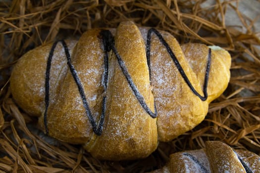 Crisp oatmeal bread wrapped with a measuring tape with i'm yits and oatmeal in the background. Top views with clear space