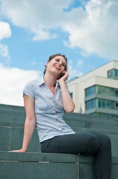 Young beautiful smiling woman calling with mobile phone