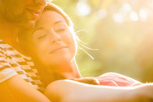 Intimate moments - young couple embracing and hugging in nature