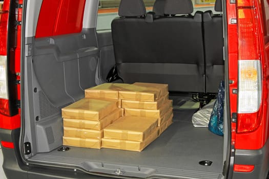 Bunch of boxes in mini van trunk