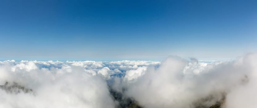 Aerial view of clear sky above the clouds