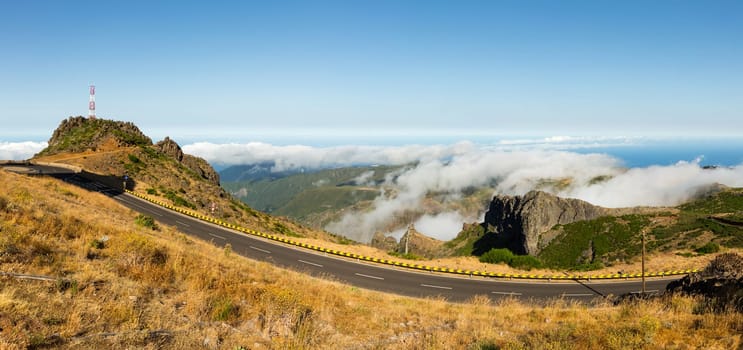 Modern runway in cloudy mountains against sky, Portugal, Madeira