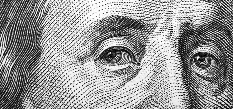 Close-up of one hundred bill Franklin portrait
