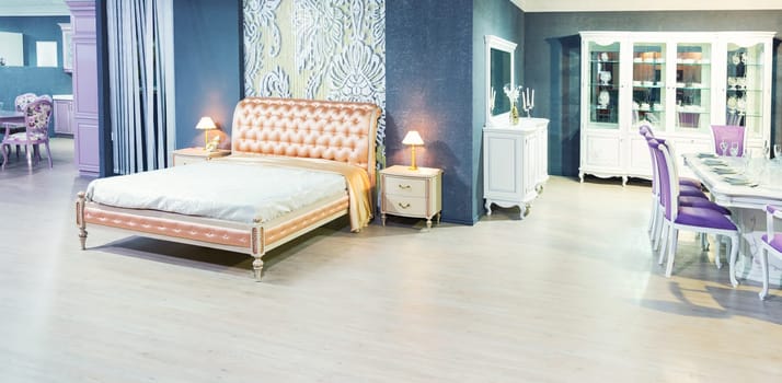 Nice double bed inbedroom and nightstand near