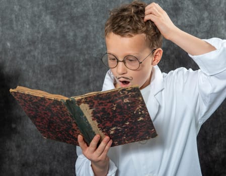 cheerful boy retro with a white blouse reading a old book