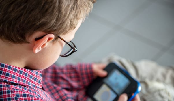 a child boy playing video game