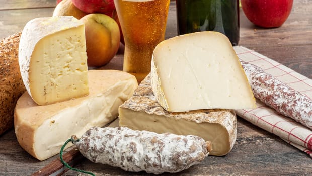 cheeses and Tomme de Savoie with beer, French cheese Savoy, the french Alps France.