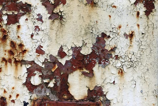Detail of the Cracked and peeled paint on the iron surface