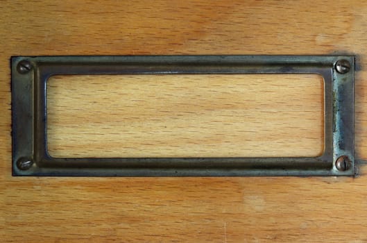 Detail of the tag - label - on the wooden board
