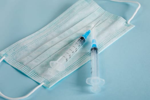 Fighting the virus and the epidemic with vaccines, pills and a medical mask